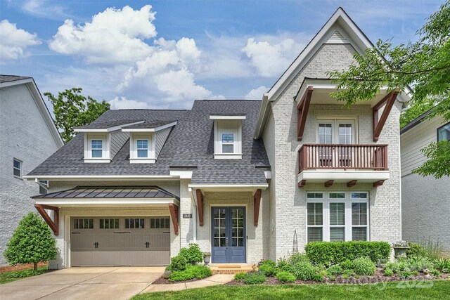 2630 Mary Butler Way, Charlotte, NC 28226 - view of front facade with french doors, a balcony, driveway, a standing seam roof, and roof with shingles