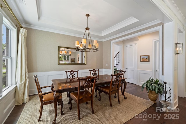 2630 Mary Butler Way, Charlotte, NC 28226 - dining room featuring a decorative wall, dark wood finished floors, a chandelier, a wainscoted wall, and stairway