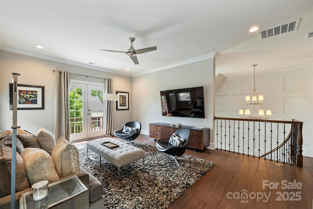 2630 Mary Butler Way, Charlotte, NC 28226 - living room featuring dark wood finished floors, a chandelier, ceiling fan, recessed lighting, and crown molding