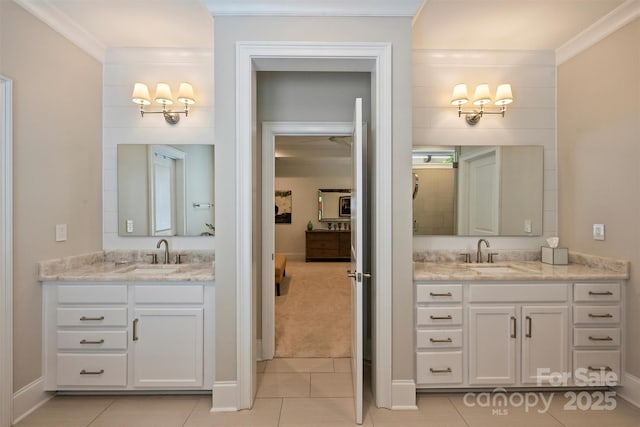 2630 Mary Butler Way, Charlotte, NC 28226 - bathroom with crown molding, two vanities, tile patterned floors, a chandelier, and baseboards