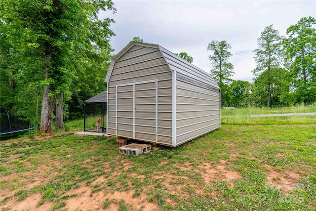 view of shed with a trampoline