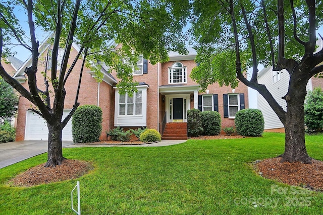 138 Montibello Dr, Mooresville, NC 28117 - view of front facade featuring brick siding, driveway, and a front yard
