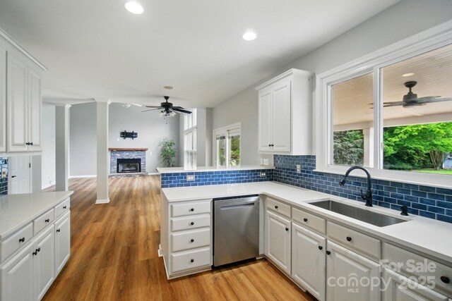138 Montibello Dr, Mooresville, NC 28117 - kitchen with stainless steel dishwasher, a ceiling fan, a sink, plenty of natural light, and recessed lighting