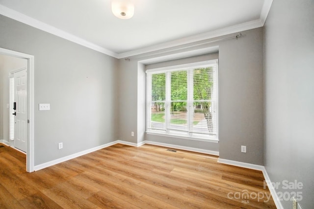 138 Montibello Dr, Mooresville, NC 28117 - unfurnished room featuring crown molding, baseboards, and light wood-type flooring