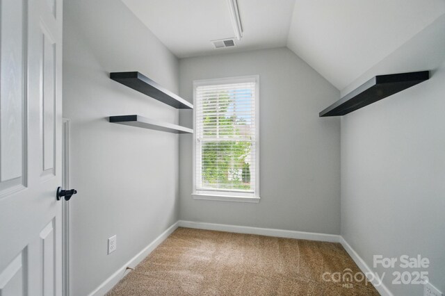 138 Montibello Dr, Mooresville, NC 28117 - walk in closet with vaulted ceiling and carpet floors