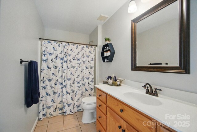 138 Montibello Dr, Mooresville, NC 28117 - bathroom with vanity, toilet, tile patterned flooring, curtained shower, and baseboards