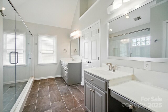 138 Montibello Dr, Mooresville, NC 28117 - full bathroom with two vanities, a stall shower, and baseboards
