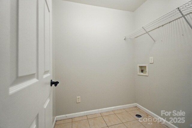 138 Montibello Dr, Mooresville, NC 28117 - laundry room featuring washer hookup, light tile patterned floors, and baseboards