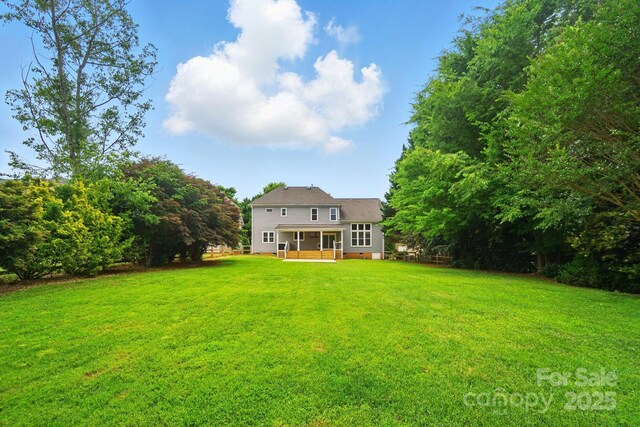 138 Montibello Dr, Mooresville, NC 28117 - back of house featuring a yard