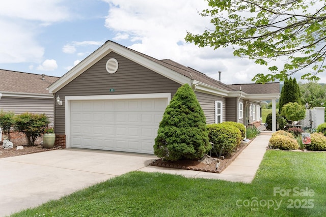 view of front facade with concrete driveway, an attached garage, and a shingled roof