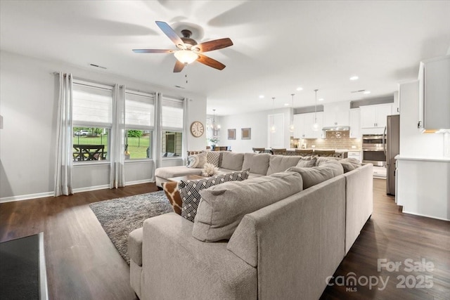 9530 Hightower Oak St, Huntersville, NC 28078 - living area featuring ceiling fan, dark wood-style flooring, recessed lighting, baseboards, and a chandelier