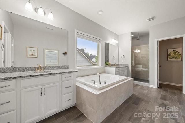 9530 Hightower Oak St, Huntersville, NC 28078 - full bathroom with a shower stall, vanity, wood finished floors, a bath, and recessed lighting