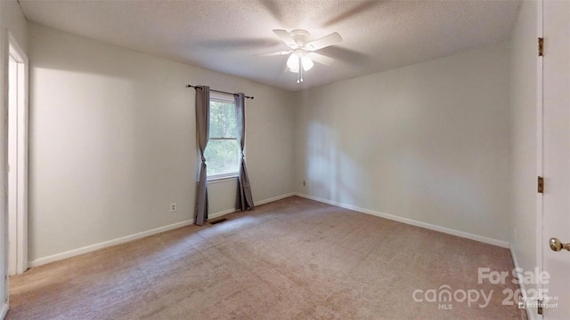 2026 Willow Ridge St, Conover, NC 28613 - empty room featuring carpet floors, a ceiling fan, a textured ceiling, and baseboards