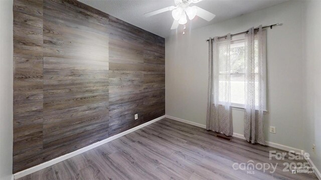 2026 Willow Ridge St, Conover, NC 28613 - spare room with a ceiling fan, baseboards, and wood finished floors