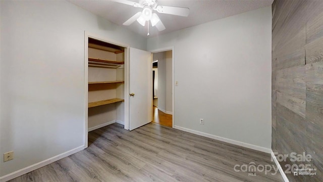 2026 Willow Ridge St, Conover, NC 28613 - unfurnished bedroom featuring wood finished floors, baseboards, and a ceiling fan