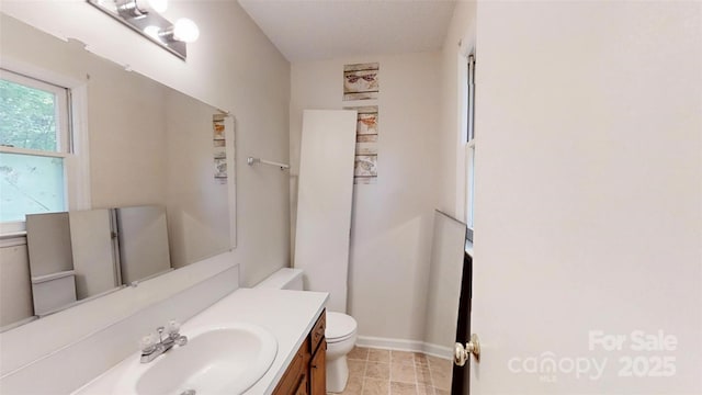 2026 Willow Ridge St, Conover, NC 28613 - bathroom featuring toilet, vanity, and baseboards