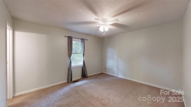 2026 Willow Ridge St, Conover, NC 28613 - empty room featuring ceiling fan, carpet, baseboards, and a textured ceiling