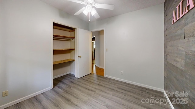 2026 Willow Ridge St, Conover, NC 28613 - unfurnished bedroom featuring wood finished floors, baseboards, and a ceiling fan