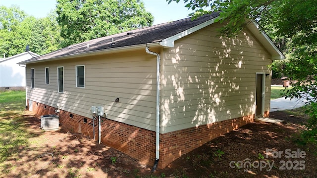 2026 Willow Ridge St, Conover, NC 28613 - view of home's exterior with crawl space, cooling unit, and a shingled roof