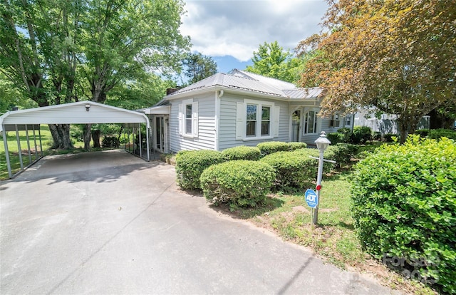 1463 Land St, Lenoir, NC 28645 - view of front of property with a detached carport, driveway, and metal roof