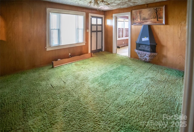 1463 Land St, Lenoir, NC 28645 - unfurnished living room with carpet flooring and wooden walls