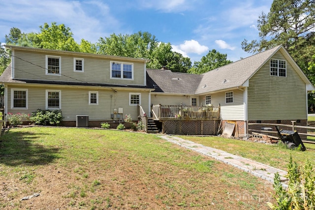 back of property featuring a wooden deck, a yard, central AC unit, and crawl space