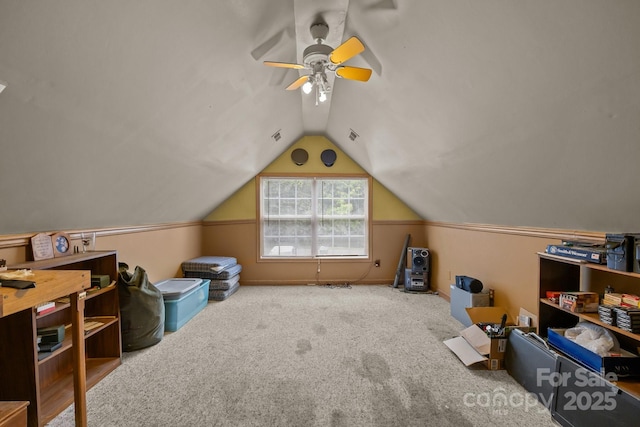 additional living space featuring carpet floors, ceiling fan, and vaulted ceiling