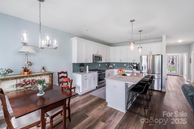 122A Deer Brook Dr Unit A, Shelby, NC 28150 - kitchen with stainless steel appliances, light countertops, dark wood-style floors, a sink, and a chandelier