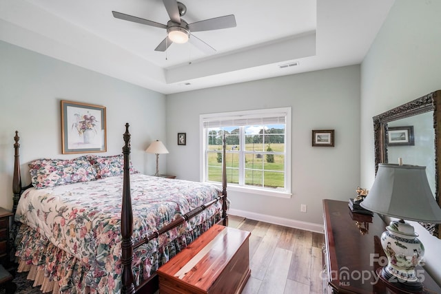 122A Deer Brook Dr Unit A, Shelby, NC 28150 - bedroom featuring a raised ceiling, light wood-style flooring, baseboards, and a ceiling fan
