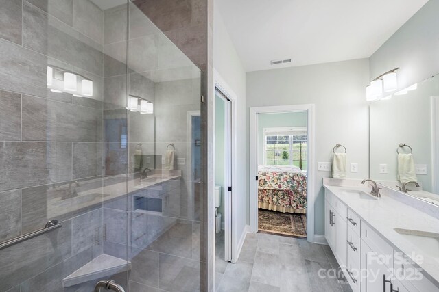 122A Deer Brook Dr Unit A, Shelby, NC 28150 - bathroom with double vanity, a shower stall, toilet, ensuite bath, and baseboards