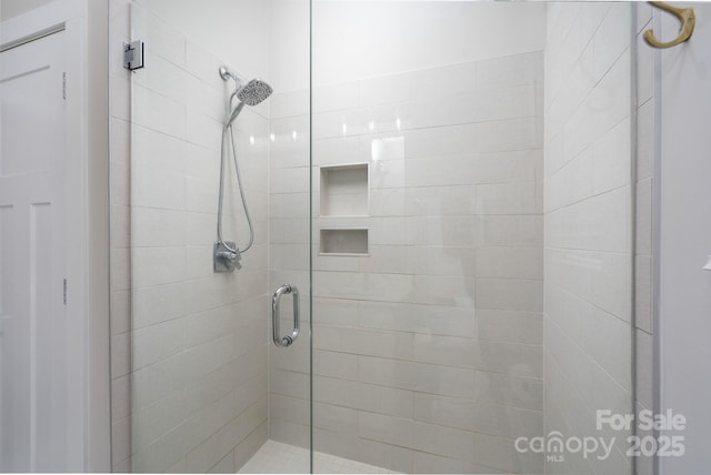 full bathroom featuring a shower stall