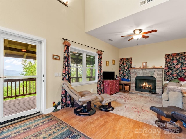 572 Multiflora Way, Waynesville, NC 28785 - living room with wood finished floors, a fireplace, ceiling fan, and baseboards