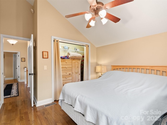 572 Multiflora Way, Waynesville, NC 28785 - bedroom featuring vaulted ceiling, wood finished floors, a closet, baseboards, and a ceiling fan
