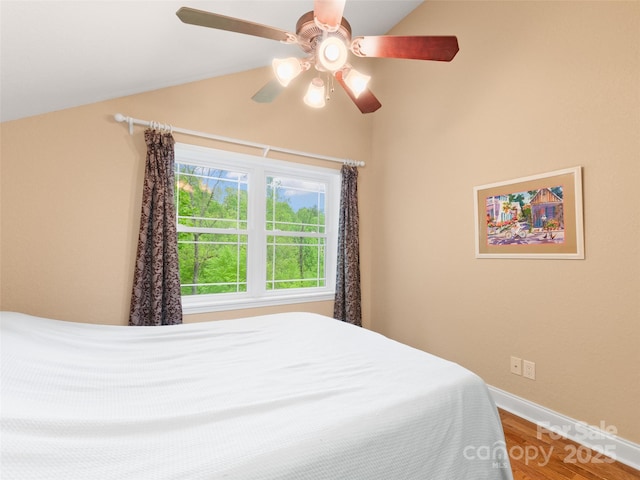 572 Multiflora Way, Waynesville, NC 28785 - bedroom with lofted ceiling, wood finished floors, baseboards, and ceiling fan