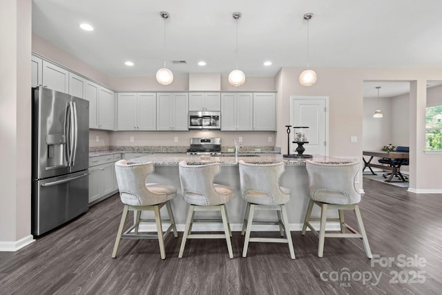 4975 Looking Glass Trl, Denver, NC 28037 - kitchen featuring stainless steel appliances, dark wood finished floors, baseboards, light stone countertops, and recessed lighting