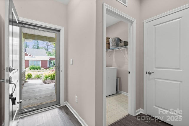 4975 Looking Glass Trl, Denver, NC 28037 - entryway with washer / dryer, baseboards, and dark wood-style floors