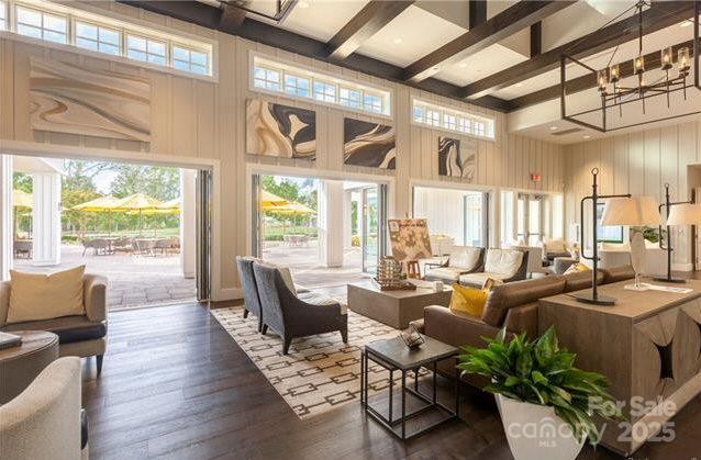 4975 Looking Glass Trl, Denver, NC 28037 - common area featuring a towering ceiling, beamed ceiling, and wood walls
