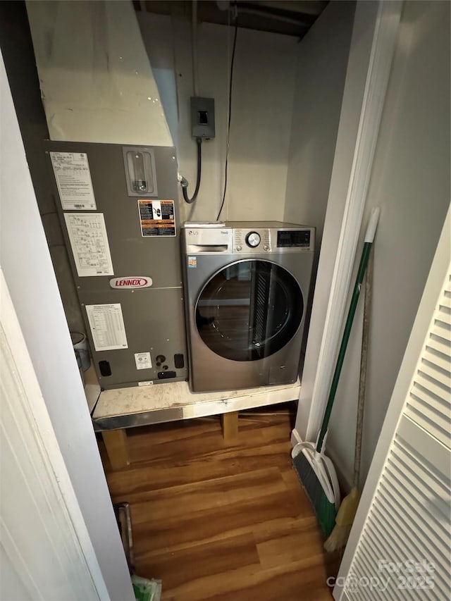 303 Sugar Top Dr Unit 2323, Sugar Mountain, NC 28604 - clothes washing area with washer / clothes dryer, wood finished floors, and heating unit