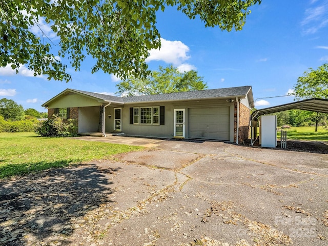 646 Terry Rd, Ellenboro, NC 28040 - single story home with asphalt driveway, brick siding, a garage, a front yard, and a carport