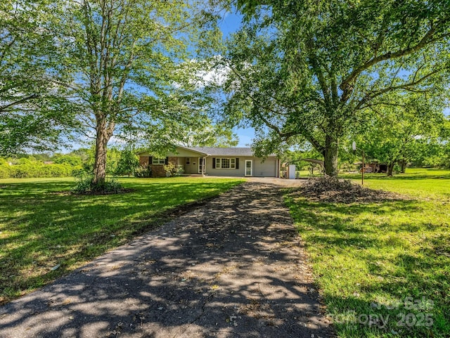 646 Terry Rd, Ellenboro, NC 28040 - ranch-style home featuring asphalt driveway, an attached garage, and a front lawn