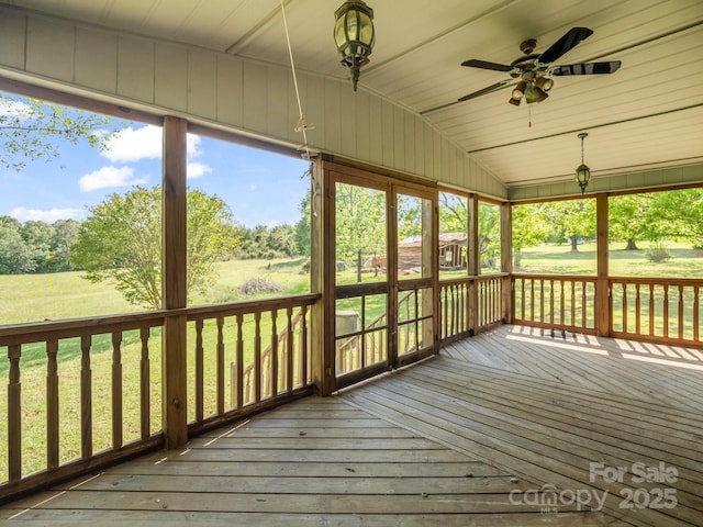 646 Terry Rd, Ellenboro, NC 28040 - unfurnished sunroom with a ceiling fan, vaulted ceiling, plenty of natural light, and view of wooded area