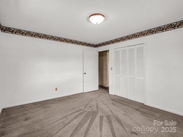 646 Terry Rd, Ellenboro, NC 28040 - unfurnished bedroom with carpet, a closet, and baseboards
