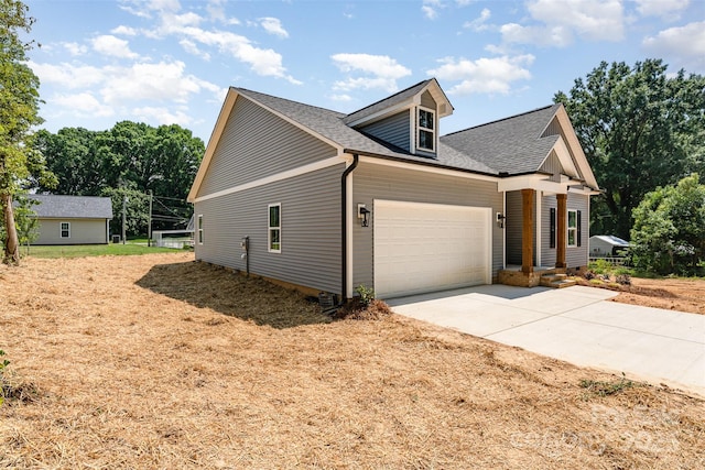 309 Walker St, Kannapolis, NC 28081 - view of front of property with a garage, concrete driveway, and a shingled roof
