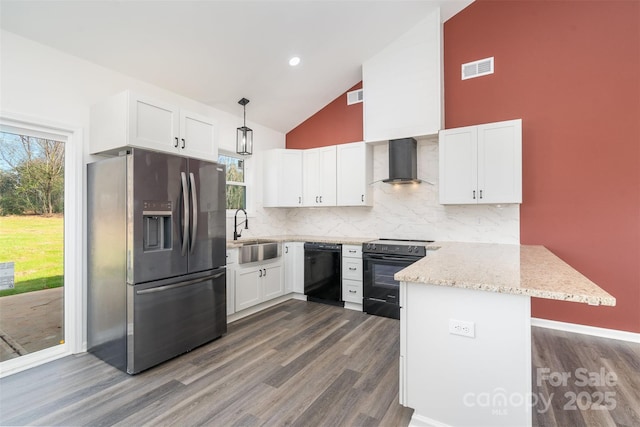 kitchen featuring black appliances, a sink, wall chimney range hood, dark wood-style floors, and high vaulted ceiling