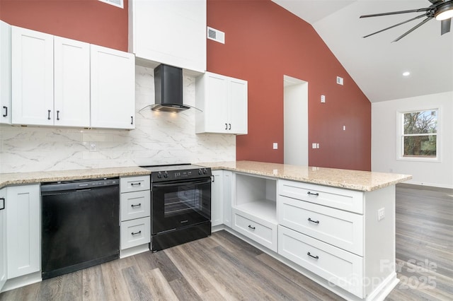 kitchen featuring black appliances, wall chimney exhaust hood, a peninsula, wood finished floors, and high vaulted ceiling