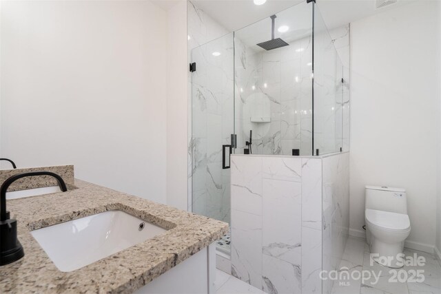 full bath with a sink, a marble finish shower, toilet, marble finish flooring, and recessed lighting