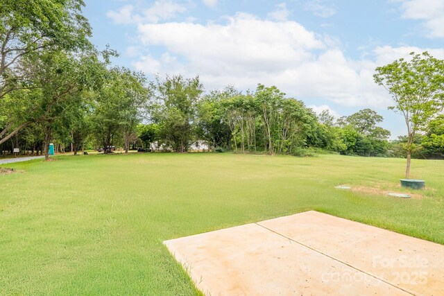 1244 Bob Falls Rd, Shelby, NC 28150 - view of grassy yard with a patio and view of wooded area
