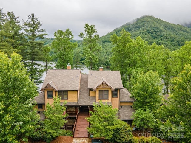 85 Southshore Dr Unit A2, Tuckasegee, NC 28783 - view of front of home featuring a mountain view, roof with shingles, and a chimney