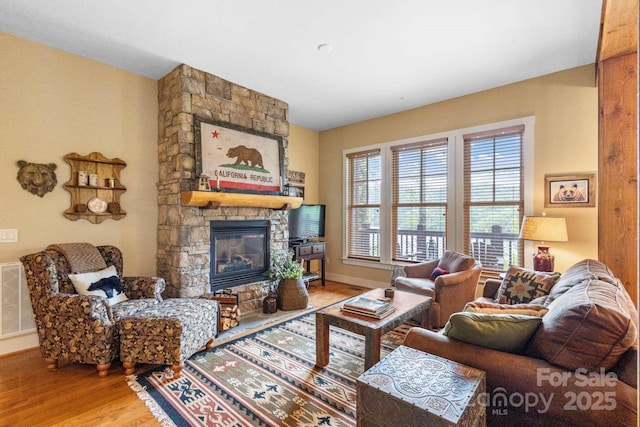 85 Southshore Dr Unit A2, Tuckasegee, NC 28783 - living room with wood finished floors, a fireplace, and baseboards
