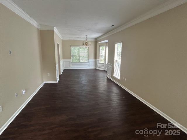 4504 Bellmore Ct, Charlotte, NC 28269 - empty room with a chandelier, dark wood-style floors, and ornamental molding